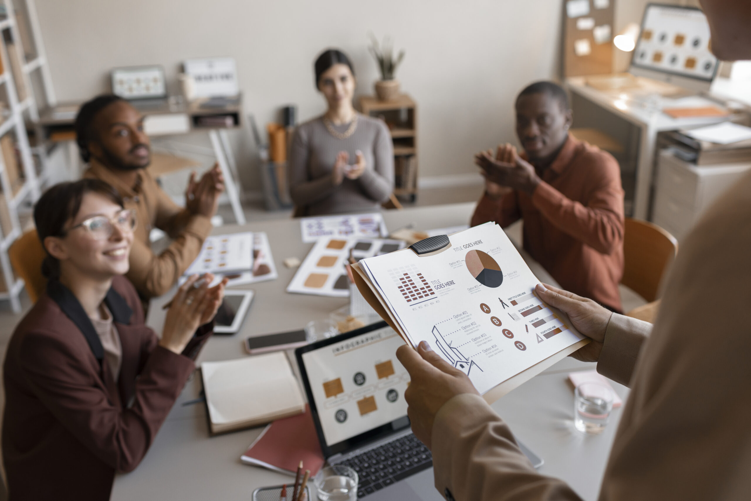 high-angle-people-applauding-at-work